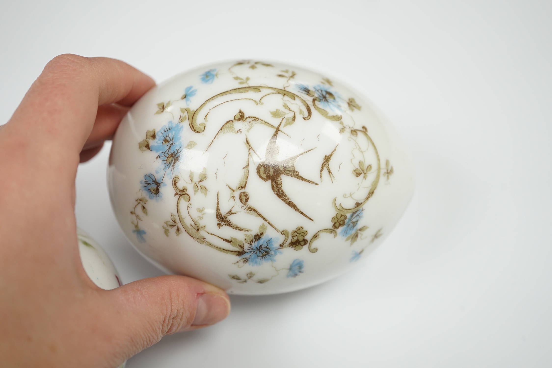 Three Russian porcelain Easter eggs, 19th century, 11cm in length